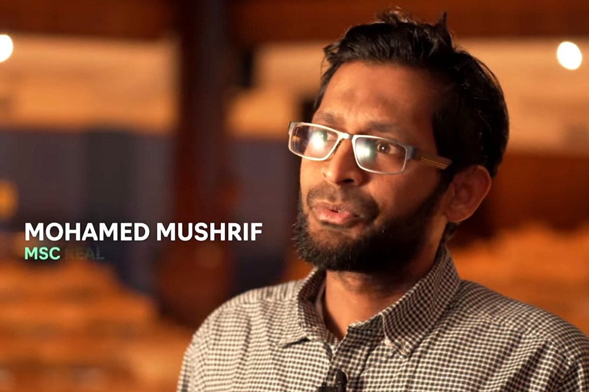 Mohamed Mushrif being filmed for the University of Aberdeen's feature on entrepreneurship and sustainability, captioned on screen with his name.